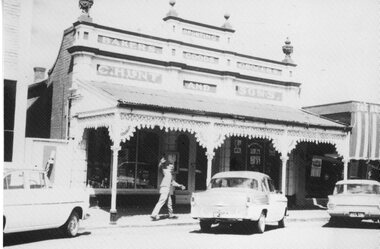 Photograph, Stawell Main Street with a man in front of C. Hunt and Sons 1960's