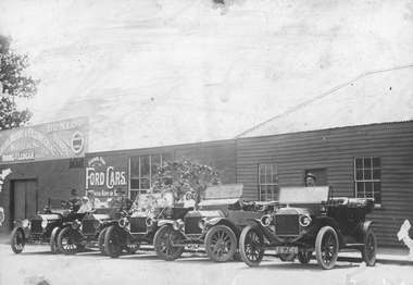 Photograph, Wimmera Motor & Engineering Works with 5, c 1920 Ford Cars in the front, c1920
