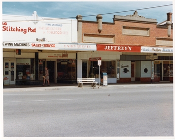 Photograph, Pleasant Creek Special School, Stitching Post - Maurie Kennedy, Ivan McDonald Men's Hairdresser, Jeffrey's Electrical, Kurts Coiffure Ladies Hairdresser, Health Food Shop - Ruthven Nov 1975, Nov 1975