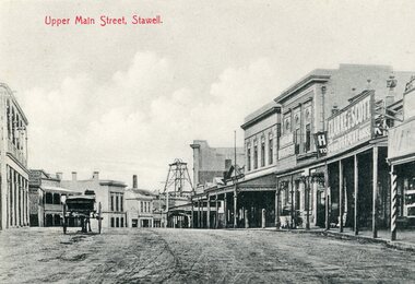 Postcard, Upper Main Street Stawell looking East with on left the 2 story Allingham building & behind the cart is the Commercial Hotel c1910