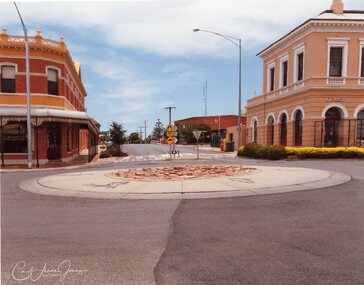 Photograph - Pizza Roundabout with stenciled Runners; looking up Wimmera Street, Carol Ann Jones, Pizza Roundabout Cr. Main & Wimmera Streets  26th January 2020, 26/1/2020