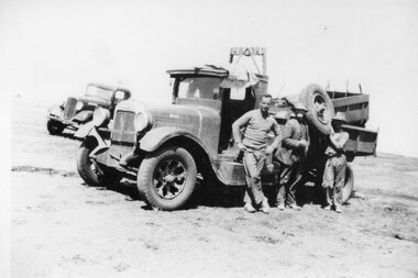 Photograph, Trucks Equipment & Workman Left could be Antonio Gnata