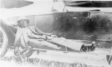 Photograph, Mr Walter Christian lying on Running board of a car, 1900 - 1940