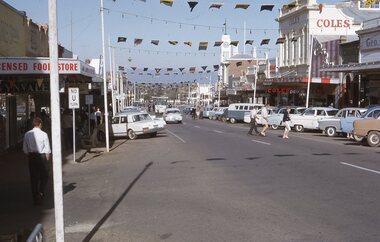 Photograph - Slide, Main Street at Easter with flags