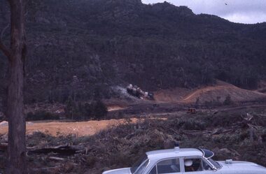 Slide, Ian McCann, Lake Bellfied showing explosion frrom the road, 1960's