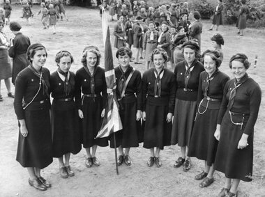 Photograph, Group Stawell 1st Rangers Company in Guide Uniform with flag in Hamilton for Queen Elizabeth II visit 1954