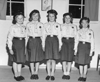 Photograph, Five young Girl Guides in Uniform in Guides Hall