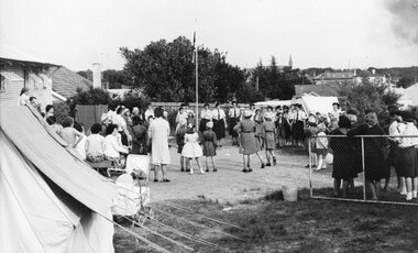 Photograph, Brownies around flagpole in front of guide hall