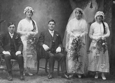 Photograph, Studio group Portrait of three ladies and two men in Wedding outfits 1916