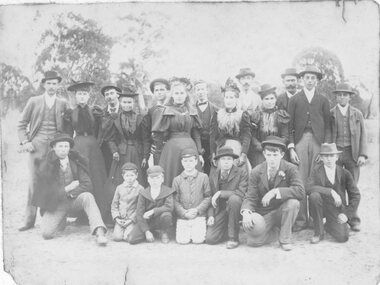 Photograph, Group of men women and boys in outside setting Great Western