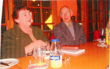 Photograph, Two People Seated behind a table