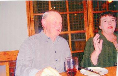 Photograph, Two People Seated behind a table