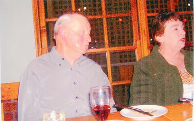 Photograph, Two People Seated behind a table