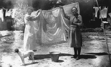 Photograph, Two sisters Bess Cragg on left and Marjorie Cragg on right hanging up washing. c1925