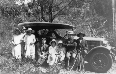 Photograph, Nana's Blue 495. Cragg family group of men and women beside car