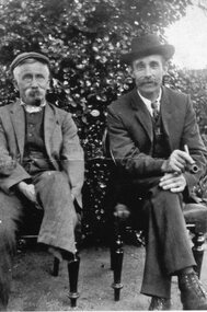 Photograph, Mr Huntley and William Cragg on dining room chairs in garden
