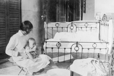 Photograph, Mother with Baby Anna Goh one year old in bedroom - Anna Goh Collection