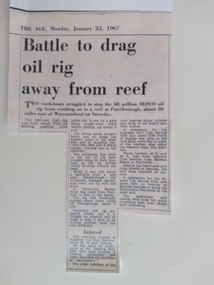 Newspaper - Battle to drag oil rig away from reef