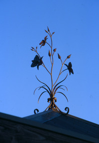 Sculpture (finial): Malcolm Laurence (b.1974 Melb), Malcolm Laurence, Chocolate Lilies: The Spirit of Nillumbik Location: Eltham Town Square - Main St, Eltham, 2001