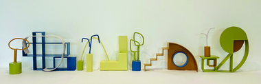 A series of 8 small three-dimensional sculptures of varying dimensions, made from painted steel. Each sculpture is roughly 25cm tall, and consists of abstract geometric shapes. The colour palette consists of muted green, brown, blue and yellow.