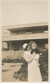 Sr Peg Pollock, Edward Wilson Block in background