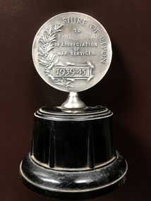 Miss A M Brown_War Service 1939-1945_Medallion on stand_from Shire of Ripon