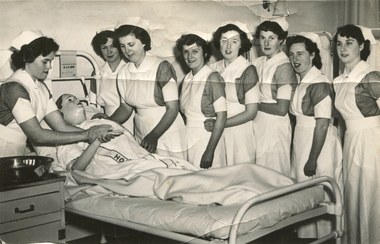 PTS October 1952, Winsome Menadue standing next to bed, left side of patient