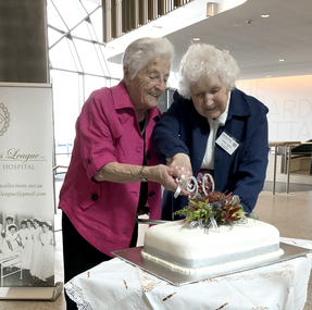 90th Annual Reunion, Rita Perkins (nee Lloyd) & Alma Egan (nee Wunhym) cutting cake at Ballarat Health Services