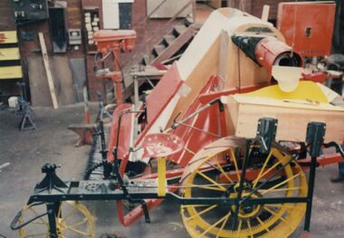 Photograph - Restoration of early stripper harvester, 1986