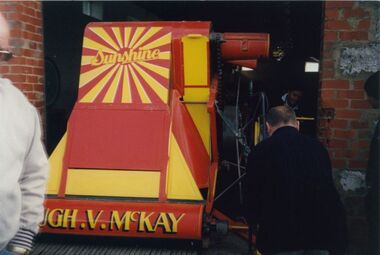 Photograph - Stripper harvester moving to Sunshine Library on 9 October 1996