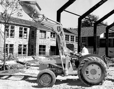 Photograph - Massey Ferguson 702 Loader with rear blade attachment at work on a building site photograph