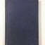 Blue cloth covered book with debossed scrollwork in each corner and in the centre. There are some areas of dark staining from age and use.