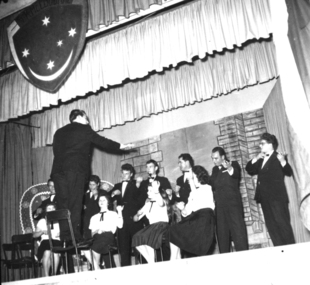 Photo of an orchestra with no instruments, Pretend orchestra performing at the Cultural evening