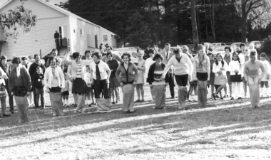 Photo of a ladies game, Ladies competing in a sack race at Slovenian picnic in 1962 at Wandin East, 1962