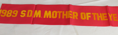 red satin sash, Marcela Bole - Mother of the Year 1989 sash, 1989