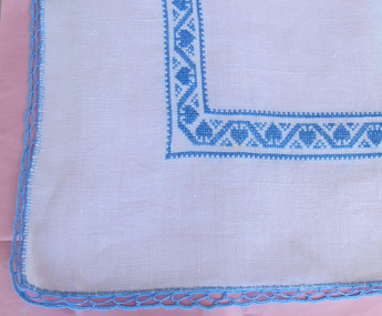 Blue cross stitch doily, Neva Roeder-Bole, blue cross stitch on white doily