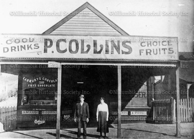 Photograph - Black & white photograp, Perce and Violet Collins outside their fruit shop in Chute Street, Diamond Creek