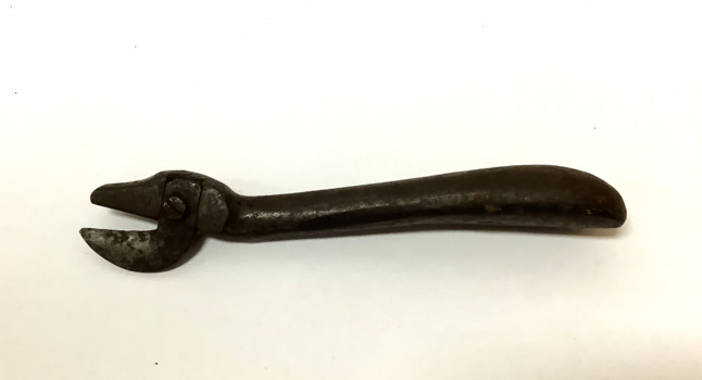 Vintage can opener, made of iron - two piece, with the cutting edge on held by a screw.