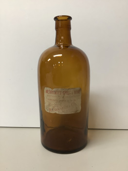 Large round brown methylated spirit bottle with original label.