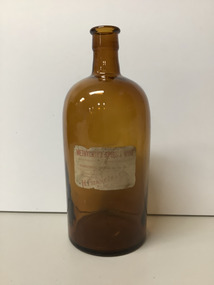 Large round brown methylated spirit bottle with original label.