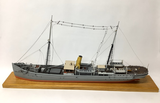 Ship model - of the steam ship “Lady Loch”, painted grey, red below waterline, two masts, rattlins on side shrouds, single funnel, two lifeboats port and starboard, varnished bridge coach house, boom on foremast, anchor catted at bow port and starboard, radio aerials strung between masts.