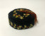 Man’s soft black cotton smoking cap with white, red and green holly embroidery and tassel.