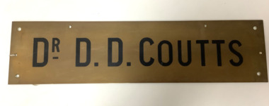 Rextangular brass plaque inscribed “Dr D.D. Coutts”