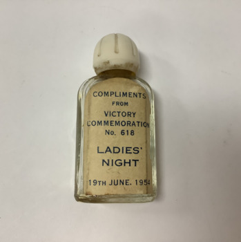 Small rectangular fluted glass perfume bottle with cream fluted plastic lid. Perfume residue, from Masonic Lodge 618, 19 June 1954