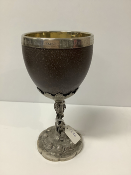 Presentation goblet - emu egg mounted on a silver base. The emu egg is lined with silver gilt, the goblet has stylised roses on the base, and vine leaves encircling the stem. Attributed to William Edwards.