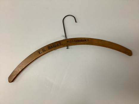 Varnished wooden coat hanger with metal hook 