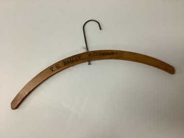 Varnished wooden coat hanger with metal hook 