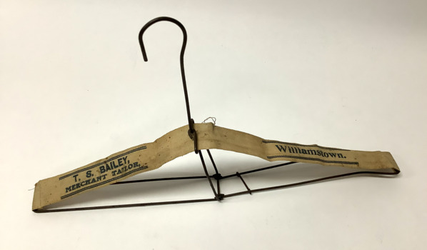 Folding wire clothes hanger, with canvas webbing strip from Baileys clothing store in Willaimstown