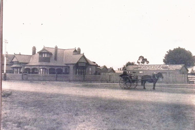 "Craignair" 242-244 Melbourne Road, Newport - home of Joseph E. Murdoch, pre 1914. He is seated in a horse and buggy in the foreground with the newly constructed house and workshop behind.