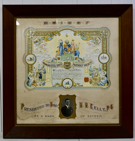Framed ornate and hand coloured certificate presented to Grand Master Barry Kelly, from the Manchester Unity Friendly Society, 1932.